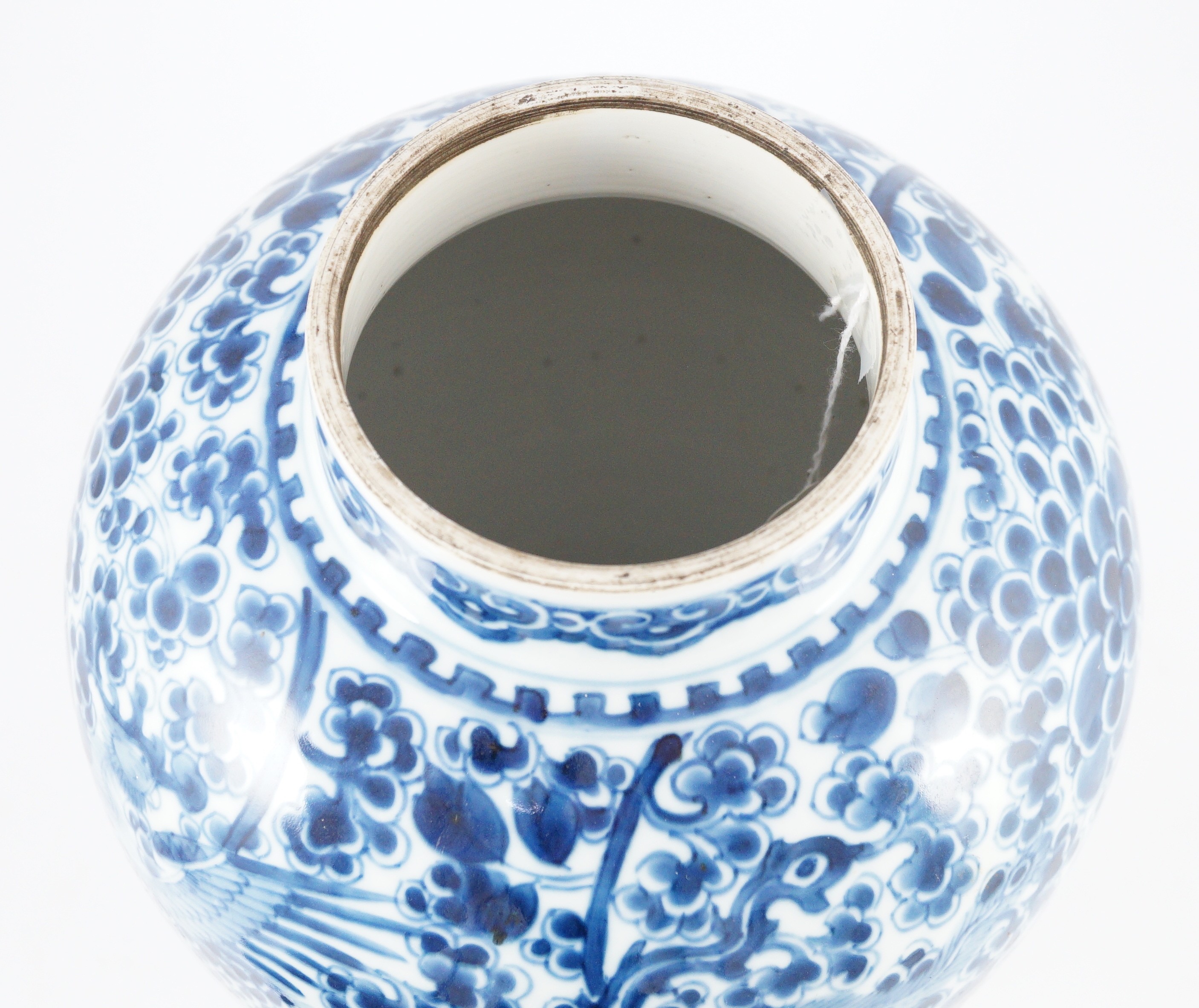 A Chinese blue and white ‘phoenix and peony’ baluster jar, Kangxi period, with a later wood cover, 36cm high excluding later wood cover